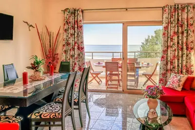 a living room with a view of the ocean at Aroma of the Sea in Kissamos