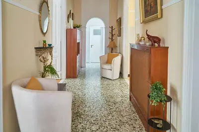 a living room with two chairs and a television at Philoxenia Residence Chania City Centre in Chania Town