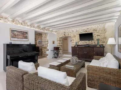 a living room with white furniture and a fireplace at Ondathaki Pirgos in Pírgos Psilonérou