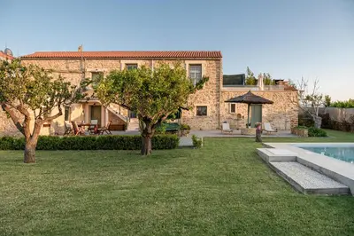 a house with a yard with a swimming pool at Ondathaki Pirgos in Pírgos Psilonérou