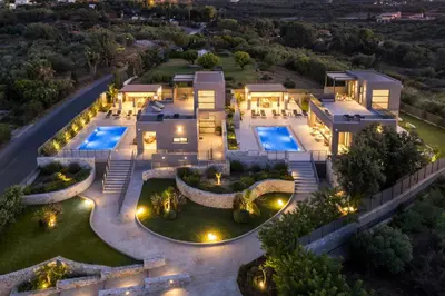 an aerial view of a mansion with two pools at Imperium Luxury Villas-Sauna, Jacuzzi, Heated Pool & Gym-Chania in Kato Galatas