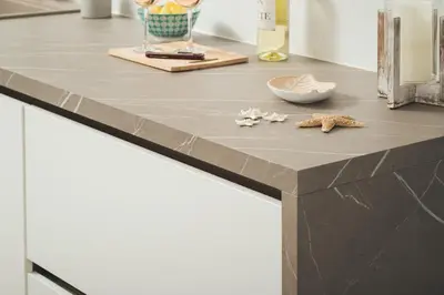 a kitchen counter with a counter top with shells on it at Aquadia Beach Apartment in Chania Town