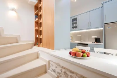 a bowl of fruit on a counter in a kitchen at Mouse House with Sea View and Mini Pool in Plataniás