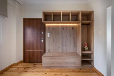 a large wooden door in a room with wooden floors at Dreamy View Inn in Chania Town