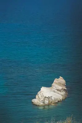 a rock in the middle of a body of water at Kera Studios in Kalyves