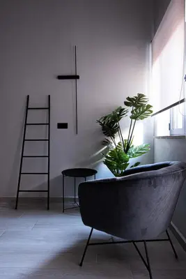 a room with a chair with plants in it at Chania Residence - City centre maisonette in Chania Town