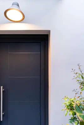 a black garage door with a light above it at Chania Residence - City centre maisonette in Chania Town