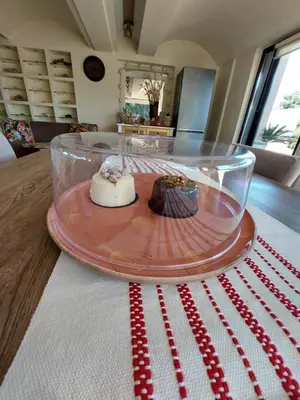 a glass plate with chocolate cakes on a table at Aphrodite View in Korakiaí