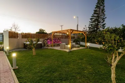 a garden with a gazebo in a backyard at Villa Albion in Kolymvari