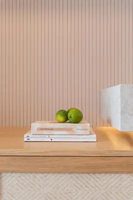 two pears sitting on top of books on a table at Esperanto Seafront suites in Agia Marina Nea Kydonias