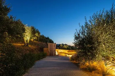 a road with a bridge and trees and a street at ÉTHAFOS Luxury Apartment in Tsikalariá