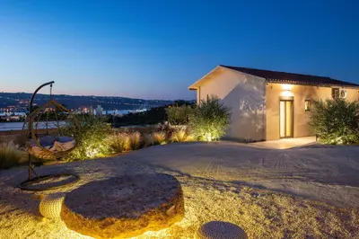 a house with a playground in the middle of a driveway at ÉTHAFOS Luxury Apartment in Tsikalariá
