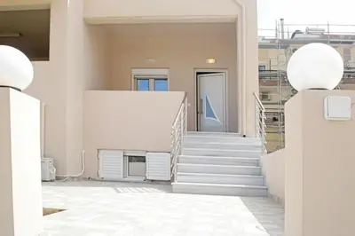 a view of a stairway in a building with white stairs at THALIA APARTMENTS CHANlA in Chania Town