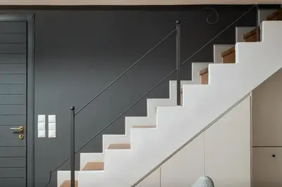 a staircase in a house with white stairs and a door at Orion Chania Boutique City House in Chania Town