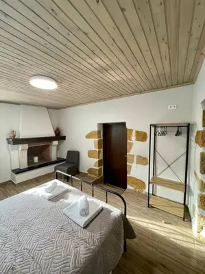 a room with a bed in a room with a ceiling at Villa Eftychia Serene Getaway with Hot Tub in a Quiet Location in Kissamos