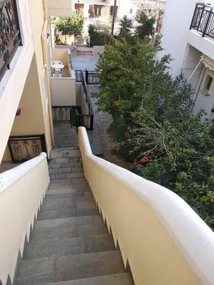 a stairway leading up to a building at Ton Mari Apartments in Palaiochóra