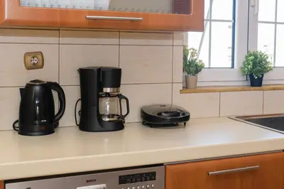 a coffee maker on a counter in a kitchen at Central penthouse in quiet neighborhood near sandy beach in Chania Town