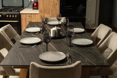 a dining room table with glasses and plates on it at Mansion D in Galatás
