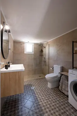 a bathroom with a toilet and a sink at MV Living - Residence in Chania Town