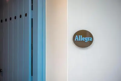 a door with an all american sign on it at Villaspo Homes in Chania Town