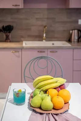 a plate of fruit on a table in a kitchen at Villaspo Homes in Chania Town