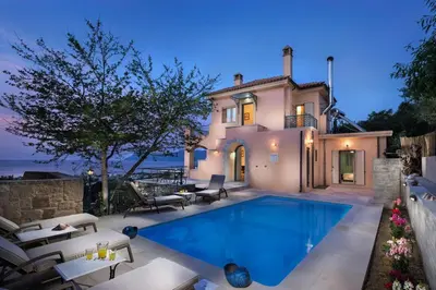 a swimming pool in front of a villa at Seaview Villa Sofia ' Top destination ' in Kissamos