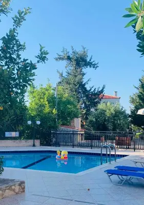 a swimming pool with a ball and a toy in it at Retreat Homes Apokoronas in Douliana