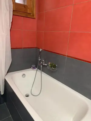 a bath tub with a faucet in a bathroom at Retreat Homes Apokoronas in Douliana