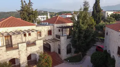 an aerial view of a building with trees at Retreat Homes Apokoronas in Douliana