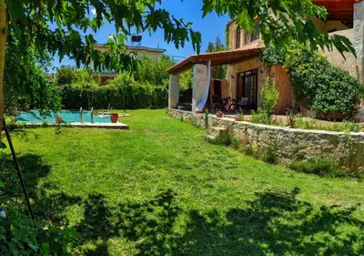 a yard with a house and a pool at Skine Dream Villa in Chania Town