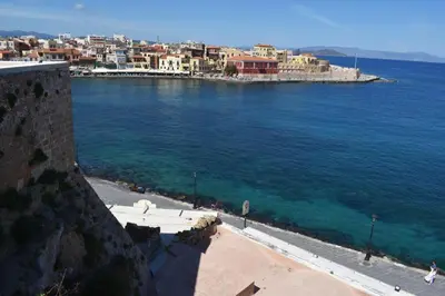a view of a city and the ocean with buildings at Loft Art Gallery, Chania, Crete in Chania Town