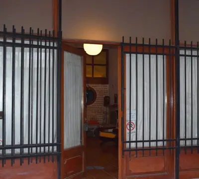 a room with two iron gates and a door at Loft Art Gallery, Chania, Crete in Chania Town