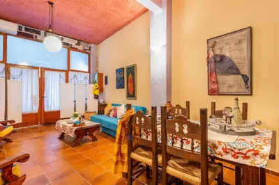 a living room with a couch and a table at Loft Art Gallery, Chania, Crete in Chania Town