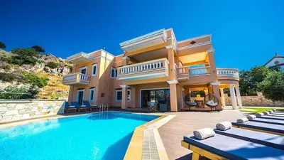 a large house with a swimming pool in front of it at Grand Olympia,Luxury, spacious indoor&outdoor area in Kissamos