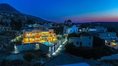 a view of a city at night at Grand Olympia,Luxury, spacious indoor&outdoor area in Kissamos