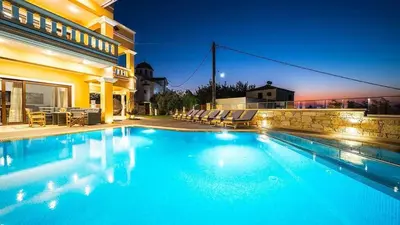 a swimming pool in the backyard of a house at Grand Olympia,Luxury, spacious indoor&outdoor area in Kissamos