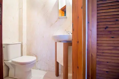 a bathroom with a toilet and a sink at Villa Palma in Maleme