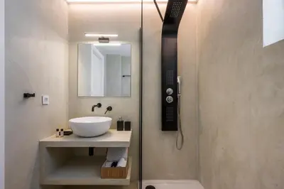 a bathroom with a sink and a shower at Villa Afeidia in Tersanas