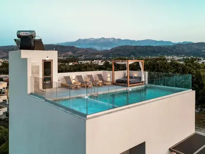 a swimming pool on the roof of a house at Soleado Villa Chania rooftop heated pool in Chania Town