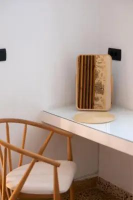 a desk with a chair and a box on it at MV Living - Studio in Chania Town