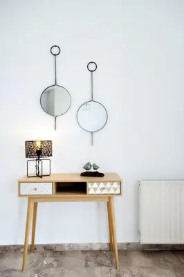 a desk with three lights hanging above it at Vagioni Seaside Villa in Kounoupidhianá