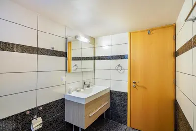 a bathroom with a sink and a mirror at Souda apartment in Souda