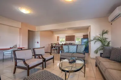 a living room with a couch and chairs and a table at Michael's Villa in Kissamos