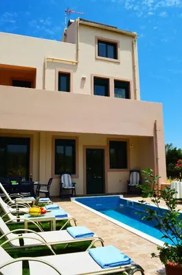a villa with a swimming pool and a house at Belle Verte Villa Maleme in Maleme