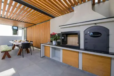 a kitchen with a fireplace in the middle of a room at Villa Night Flower in Chania Town