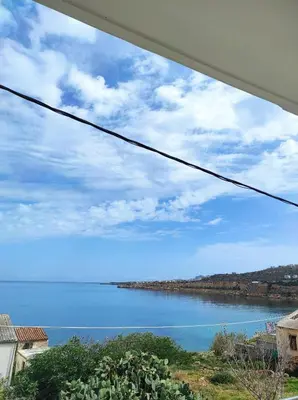 a view of a body of water from a balcony at Aura Estate in Chania Town