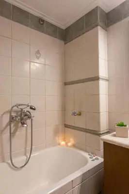 a bathroom with a bath tub with lights in it at Aura Estate in Chania Town