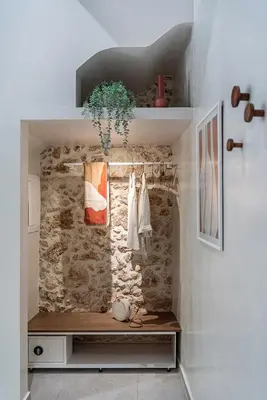 a walk in closet with a stone wall at New Boutique Venetian apartments - La Casa Nove in Chania Town