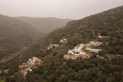 a group of houses on the side of a mountain at Square Apartment in Kambanós