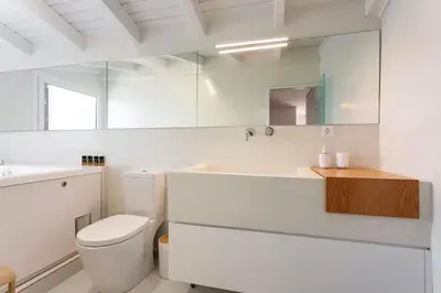 a bathroom with a toilet and a sink and a mirror at FOS - casa casa group in Chania Town